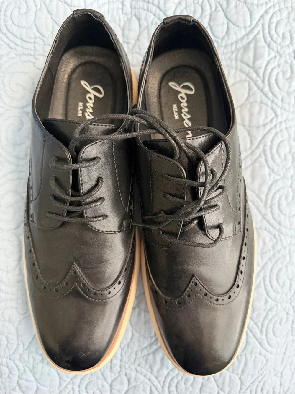 Classic Black Leather Wingtip Derby with Contrasting Tan Sole